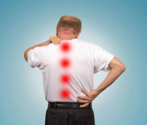 Senior man with lower and upper back pain